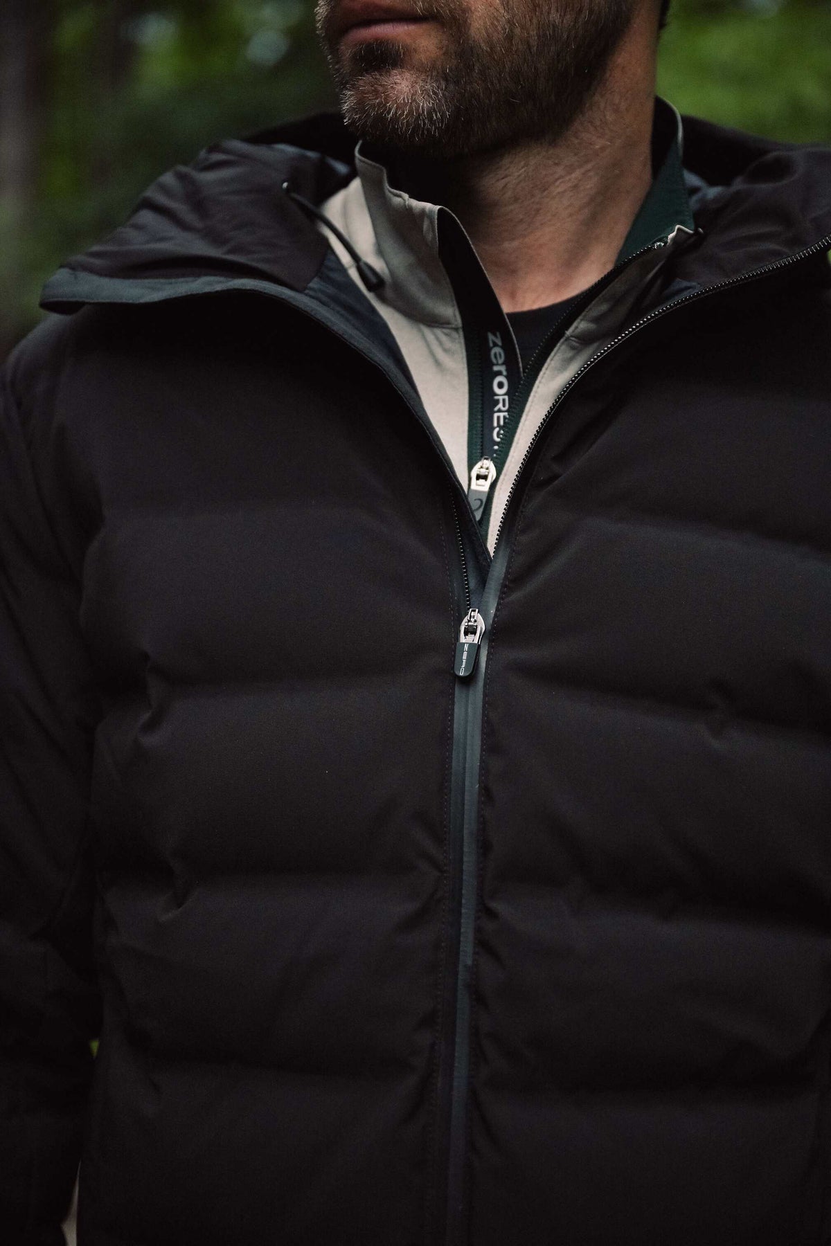 Woman walking a sidewalk in a tan quarter-zip